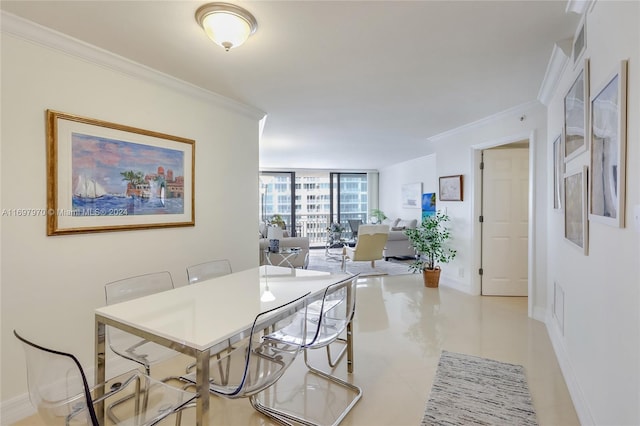 tiled dining area featuring floor to ceiling windows and ornamental molding