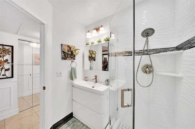 bathroom with vanity, an enclosed shower, and tile patterned flooring