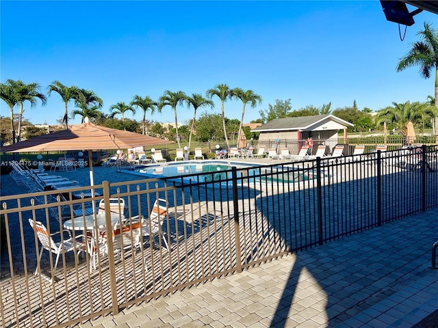 view of swimming pool featuring a patio area