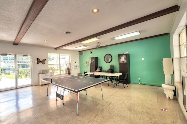 playroom featuring crown molding, beam ceiling, and a textured ceiling