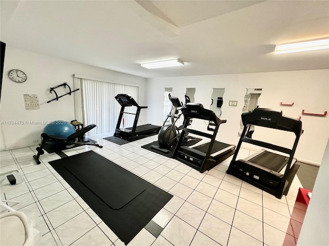 workout room featuring light tile patterned floors