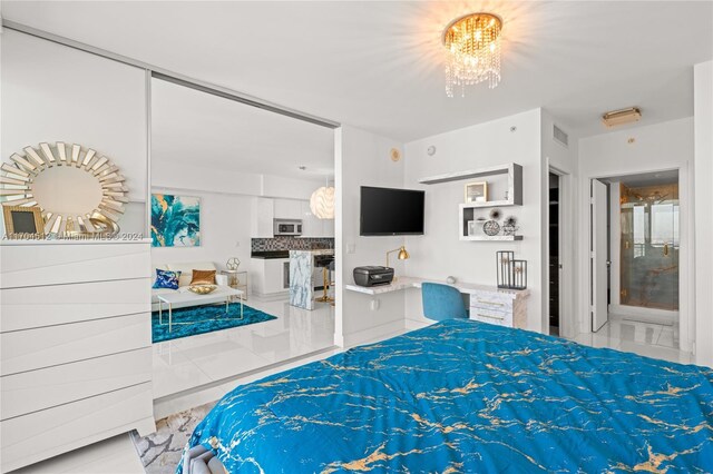 bedroom with an inviting chandelier