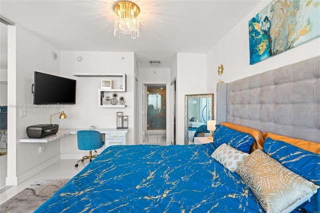 bedroom with ensuite bathroom, light tile patterned flooring, and a chandelier