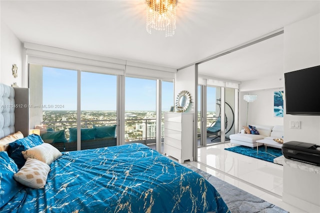 bedroom with access to outside, multiple windows, tile patterned flooring, and an inviting chandelier