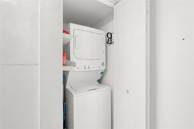 washroom featuring stacked washer and dryer