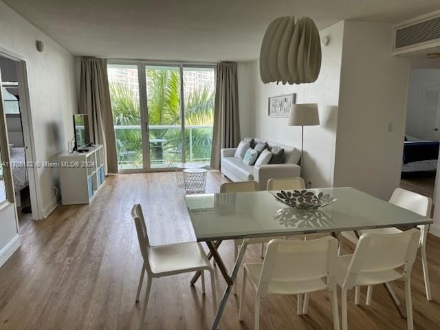 dining room with light wood-type flooring