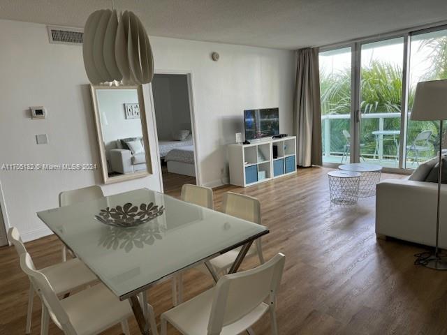 dining room with dark hardwood / wood-style floors