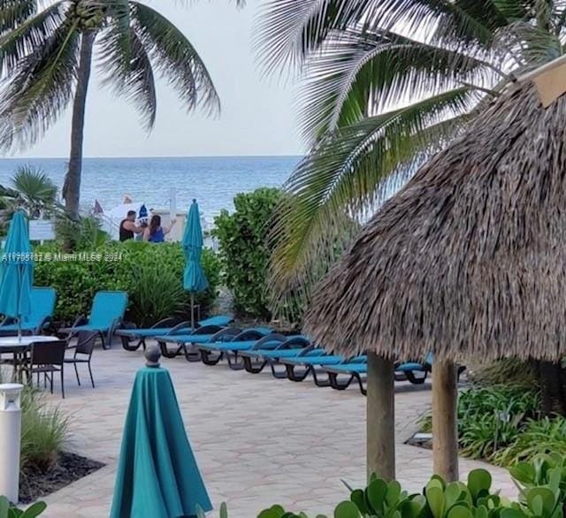 view of patio with a water view