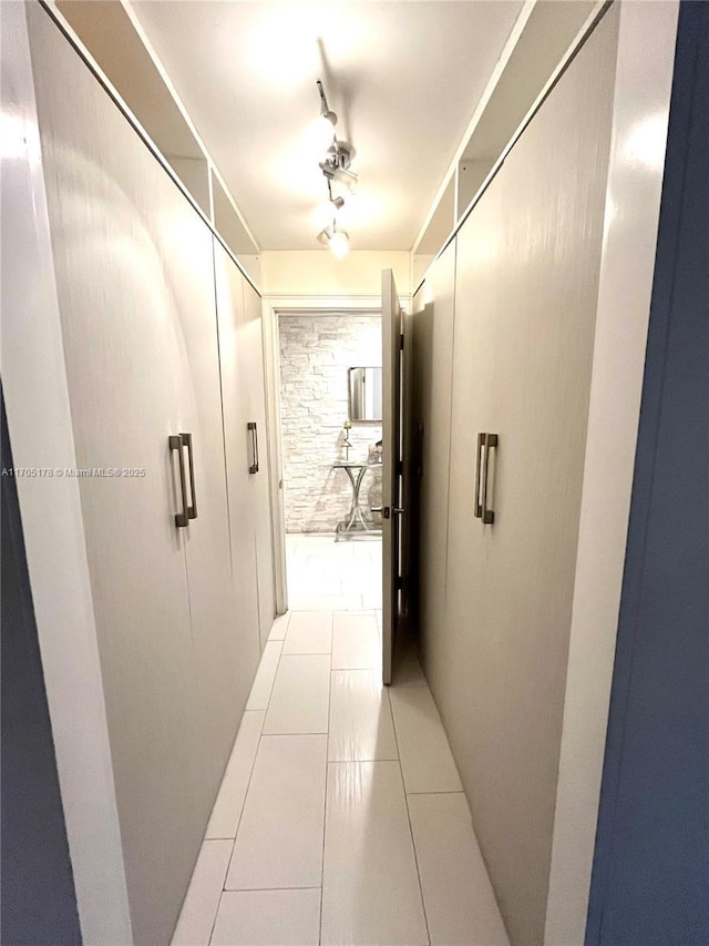 hallway with light tile patterned floors