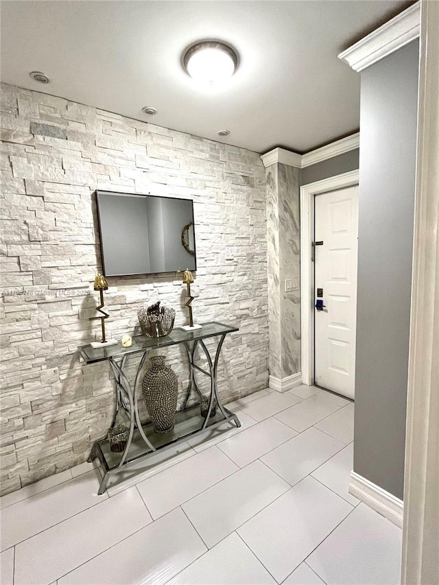 tiled foyer with crown molding