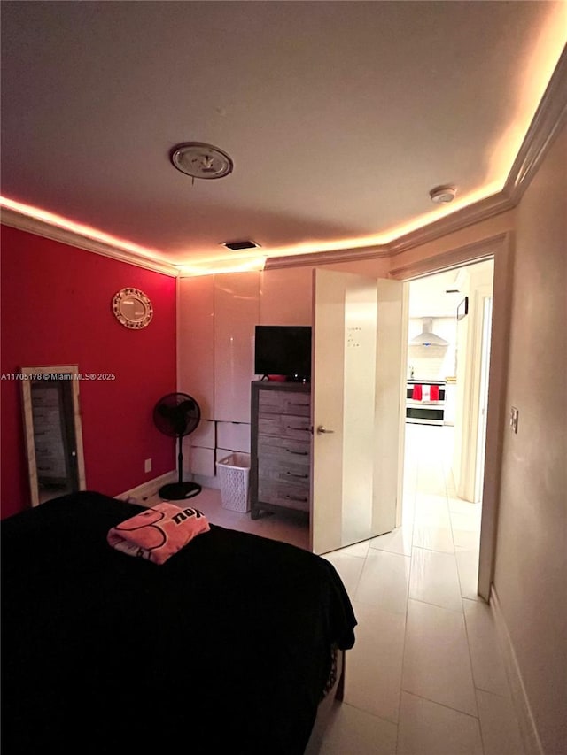 tiled bedroom with ornamental molding