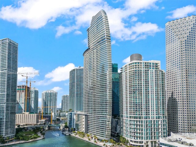 property's view of city featuring a water view