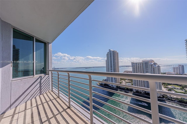 balcony featuring a water view