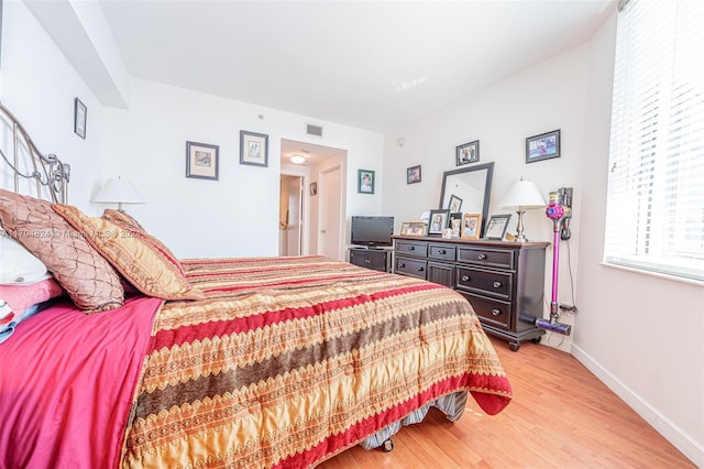 bedroom with light hardwood / wood-style flooring