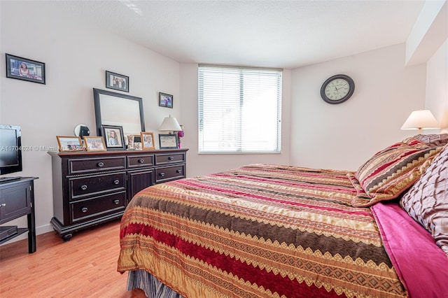 bedroom with light hardwood / wood-style floors