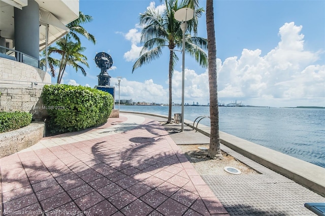 view of patio with a water view