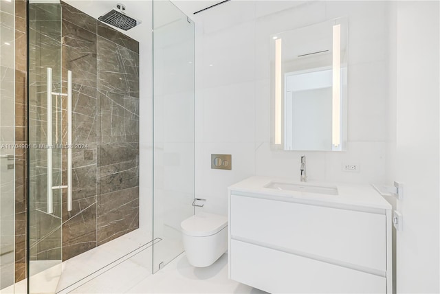 bathroom featuring tiled shower, vanity, and toilet