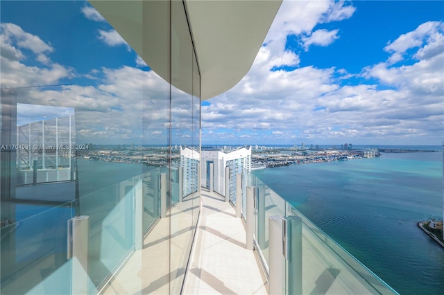 balcony featuring a water view