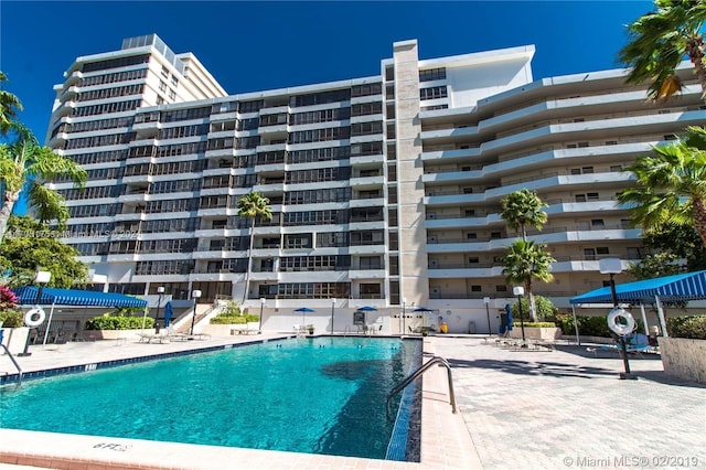 view of swimming pool with a patio area