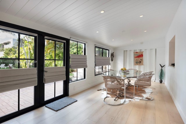 dining space featuring wooden ceiling and light wood-type flooring