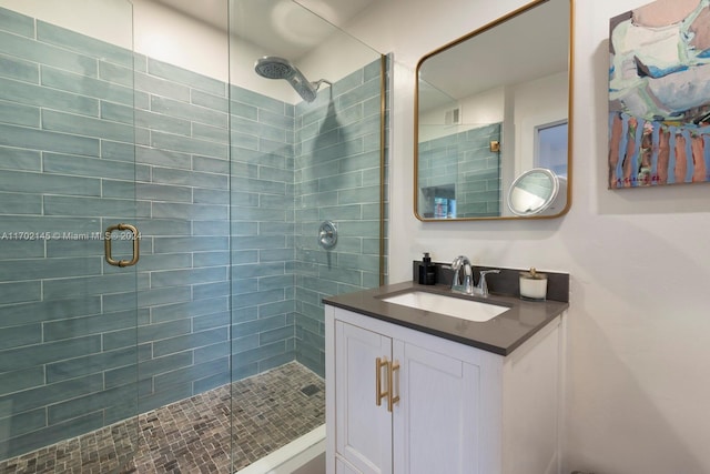 bathroom with vanity and walk in shower