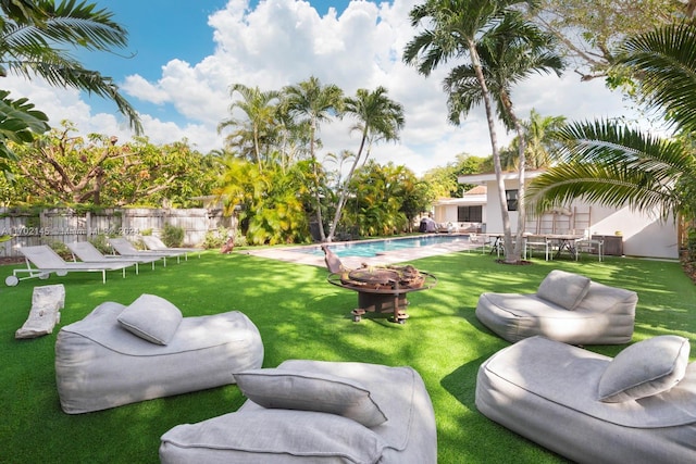 view of yard with a fenced in pool