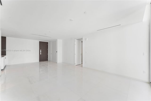 empty room featuring light tile patterned floors