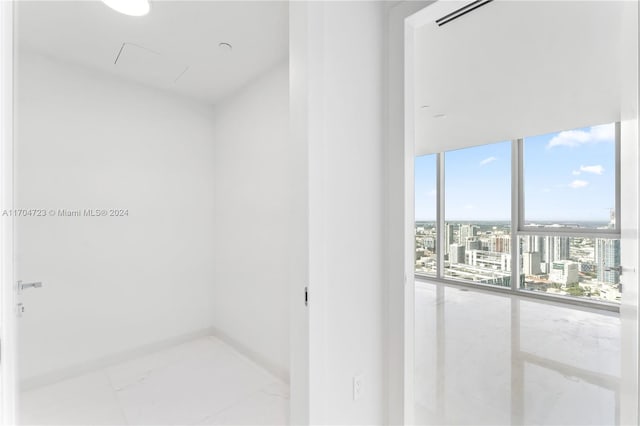 bathroom with floor to ceiling windows