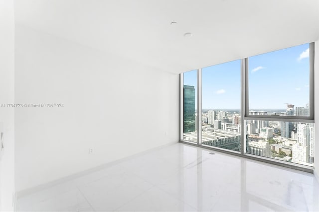 empty room with floor to ceiling windows