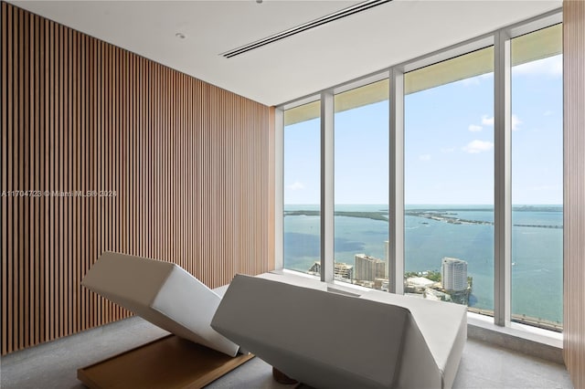 dining space with a water view and a healthy amount of sunlight