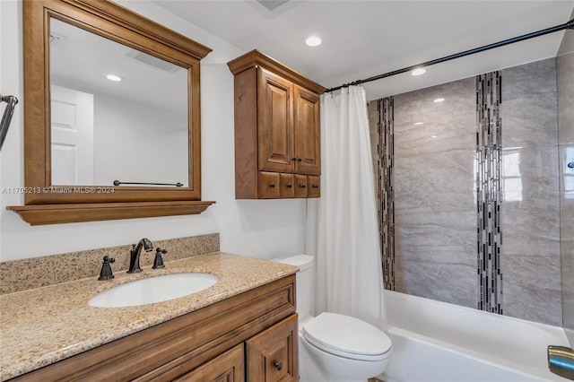 full bathroom featuring toilet, vanity, and shower / tub combo with curtain