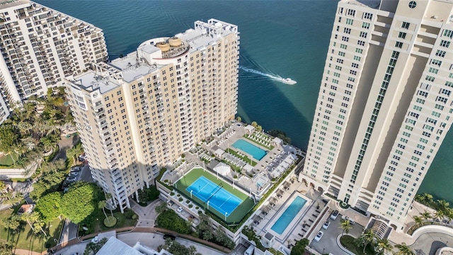 birds eye view of property with a water view and a view of city