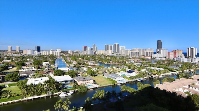 drone / aerial view with a view of city and a water view