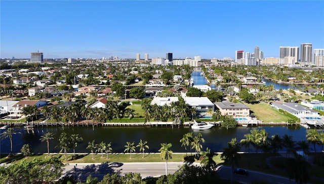 bird's eye view featuring a water view and a view of city