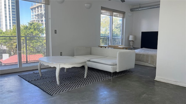 living room featuring finished concrete floors