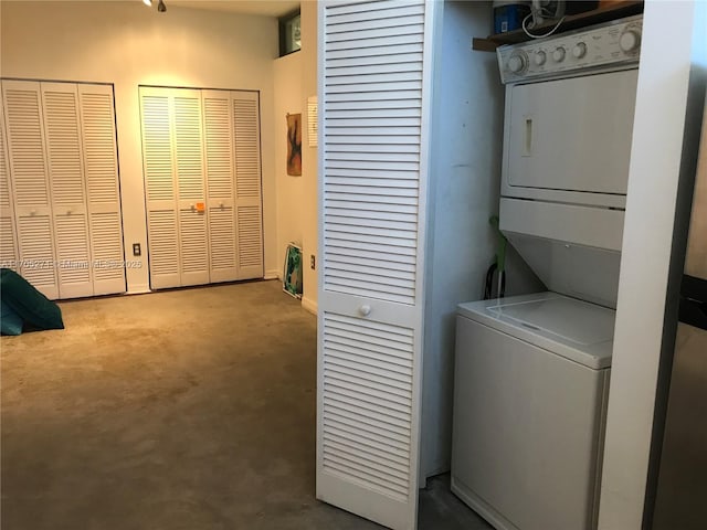 laundry area with laundry area and stacked washer / dryer