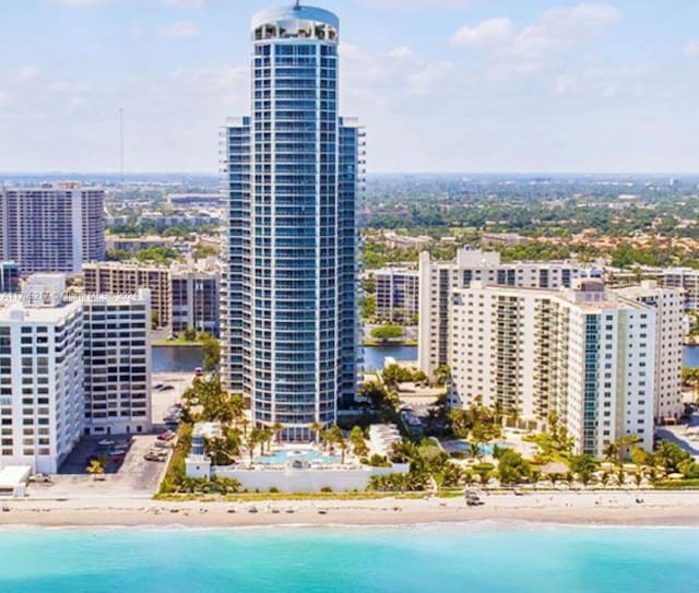 exterior space featuring a view of the beach and a water view