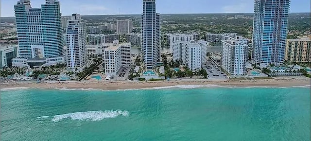 aerial view with a view of the beach and a water view