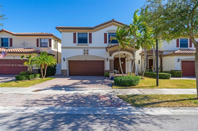 mediterranean / spanish-style home with a garage