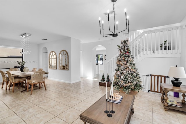 tiled dining room with a notable chandelier