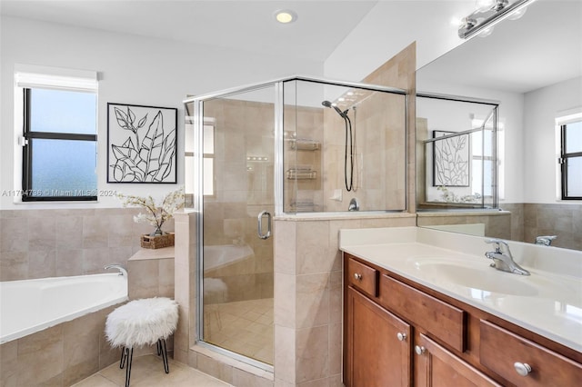 bathroom with separate shower and tub, tile patterned floors, and vanity