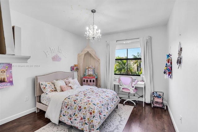 bedroom featuring dark hardwood / wood-style flooring and an inviting chandelier