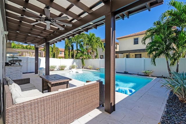 view of pool with pool water feature, ceiling fan, a patio area, and a pergola