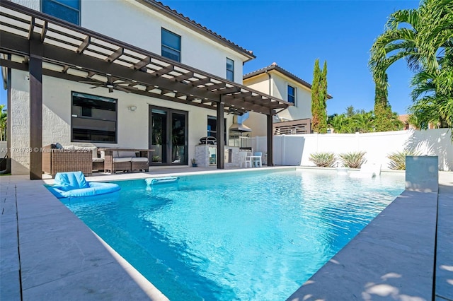 view of pool with a pergola, an outdoor living space, exterior kitchen, a bar, and a patio