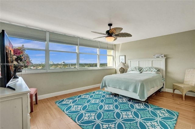 bedroom featuring ceiling fan and light hardwood / wood-style flooring