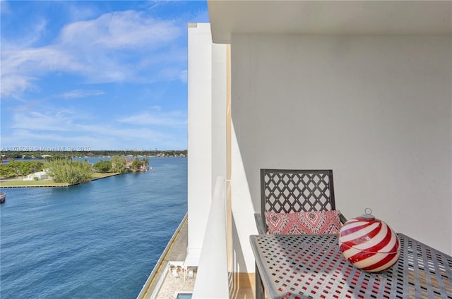 balcony featuring a water view