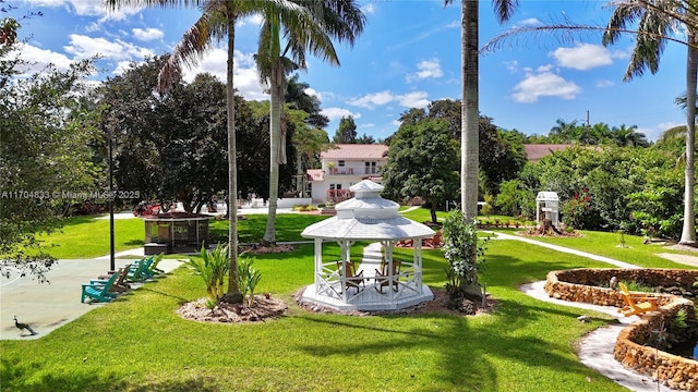 view of community with a gazebo and a yard