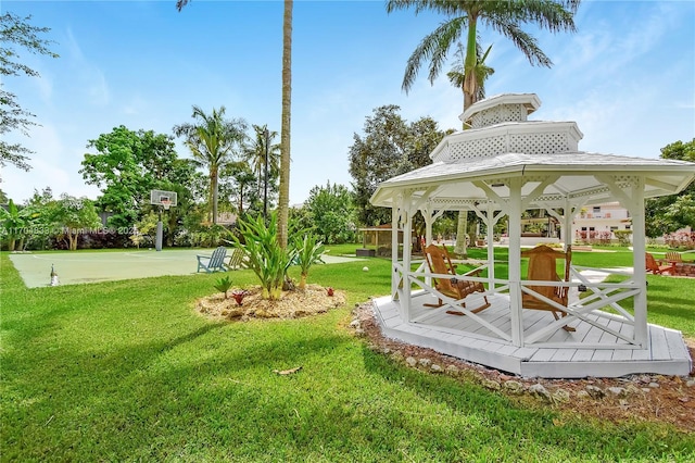 view of yard featuring a gazebo and basketball hoop