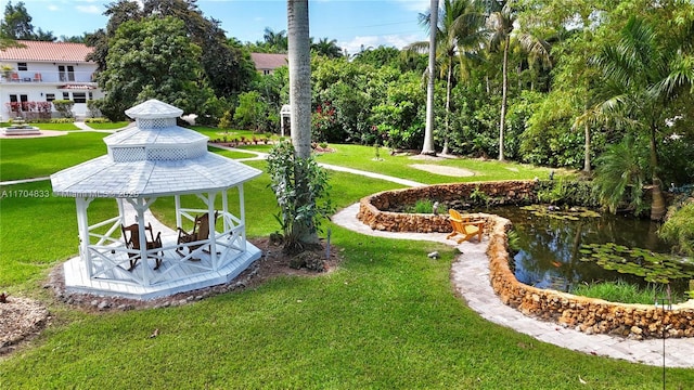 view of community with a yard and a gazebo