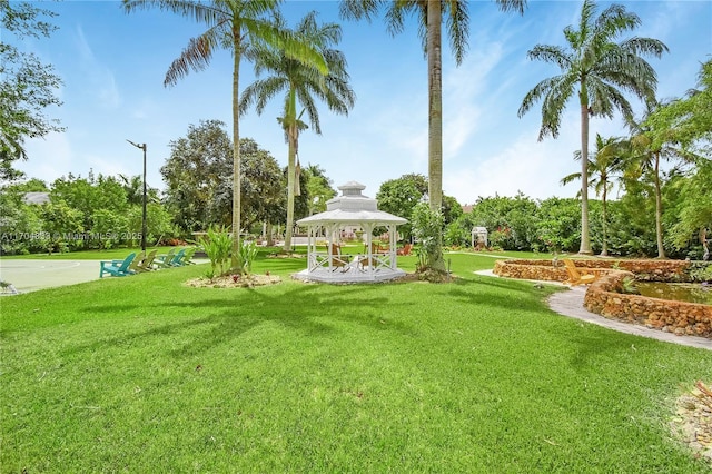 view of home's community with a gazebo and a yard